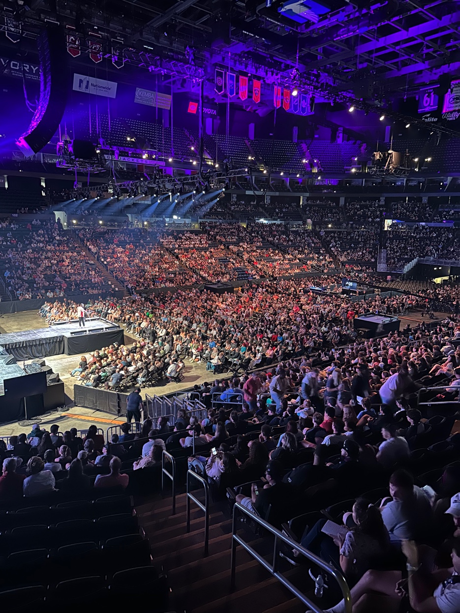 A packed arena watching Peter Reeves speak