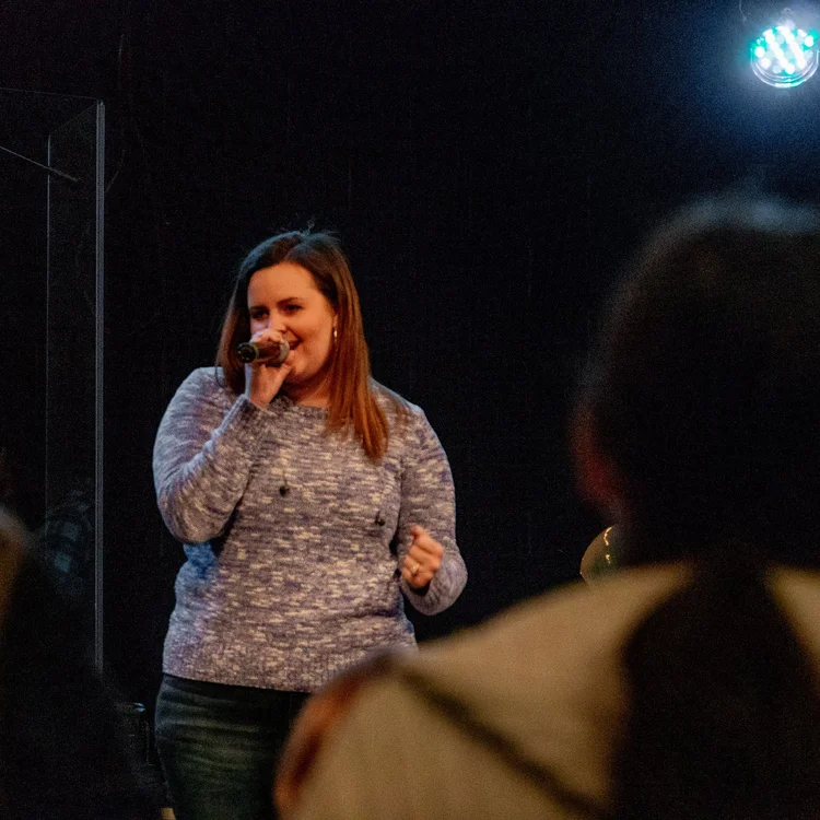 Joanna speaking on stage